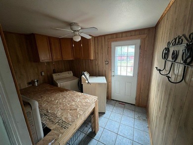 This home has one large bedroom and a half bath upstairs, and - photo 14