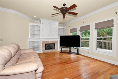 Brick home with a great view of golf course on one side and a