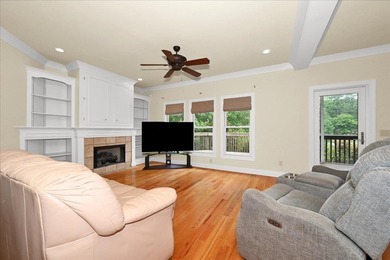 Brick home with a great view of golf course on one side and a