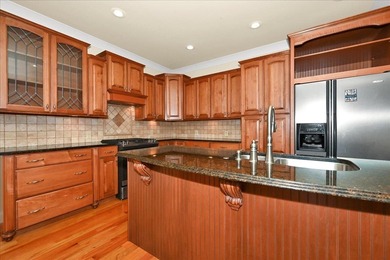 Brick home with a great view of golf course on one side and a