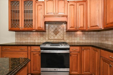 Brick home with a great view of golf course on one side and a