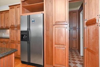 Brick home with a great view of golf course on one side and a