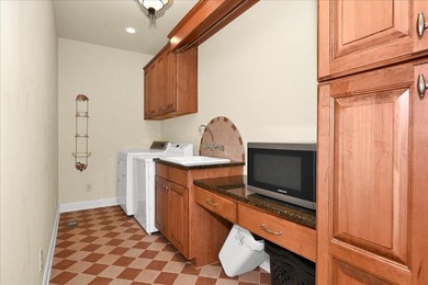 Brick home with a great view of golf course on one side and a