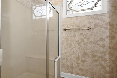 Brick home with a great view of golf course on one side and a