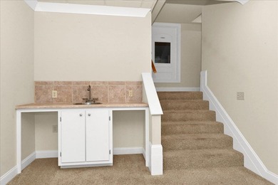 Brick home with a great view of golf course on one side and a