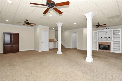 Brick home with a great view of golf course on one side and a