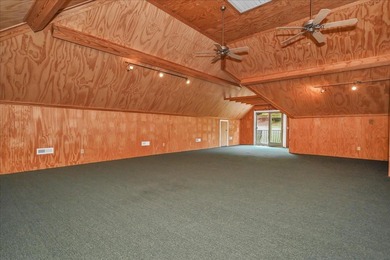 Brick home with a great view of golf course on one side and a