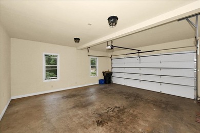 Brick home with a great view of golf course on one side and a