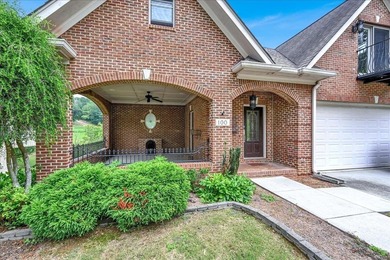 Brick home with a great view of golf course on one side and a