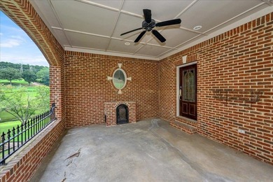 Brick home with a great view of golf course on one side and a