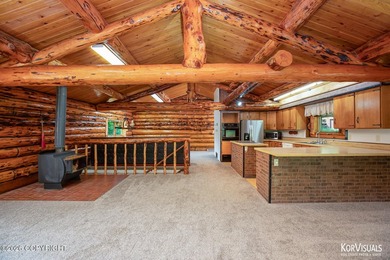 Experience the warmth and character of log home living in this - photo 5