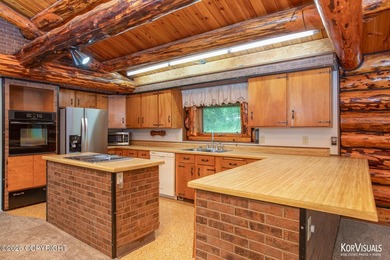 Experience the warmth and character of log home living in this - photo 9