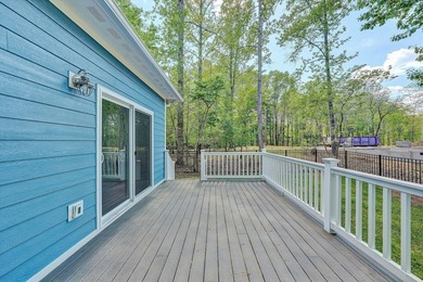 Stunning contemporary home w/seasonal lake views offers modern - photo 29
