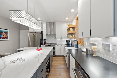 Step into refined living with this beautifully remodeled - photo 9