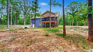 Tucked into a wooded setting just minutes from Kentucky Lake and - photo 33