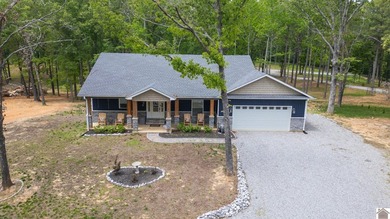 Tucked into a wooded setting just minutes from Kentucky Lake and - photo 35