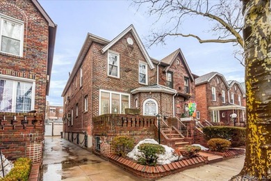 Welcome to 1404 E 49th Street, a semi-detached brick one-family - photo 1