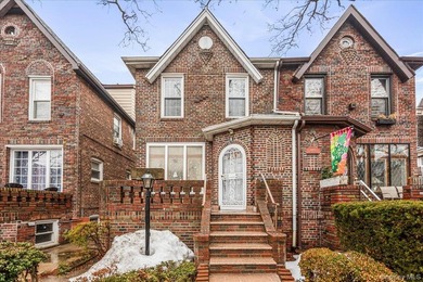 Welcome to 1404 E 49th Street, a semi-detached brick one-family - photo 2