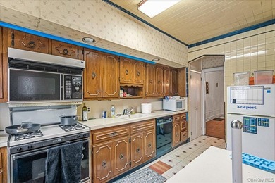 Welcome to 1404 E 49th Street, a semi-detached brick one-family - photo 9