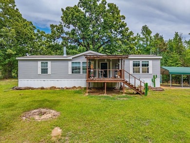 Well-maintained 3 bedroom, 2 bath mobile home on 74 acres. The - photo 2