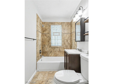 This 3-bedroom, 2-bath bungalow offers a bright, open feel with - photo 17