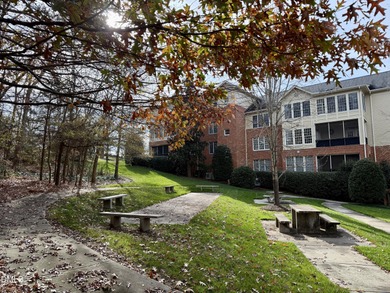 Gorgeous Hilltop Condo end unit overlooking the trees! Refined