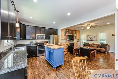 This beautiful lakefront home on over an acre features an open - photo 11
