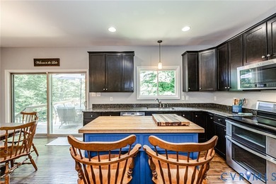 This beautiful lakefront home on over an acre features an open - photo 13