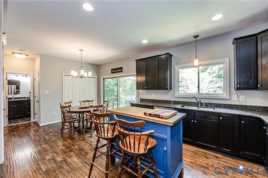 This beautiful lakefront home on over an acre features an open - photo 14
