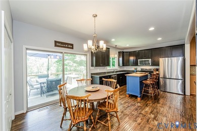 This beautiful lakefront home on over an acre features an open - photo 16