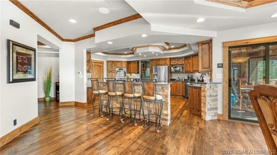 Lodge-style lakefront retreat sitting on over 1 acre with an - photo 14