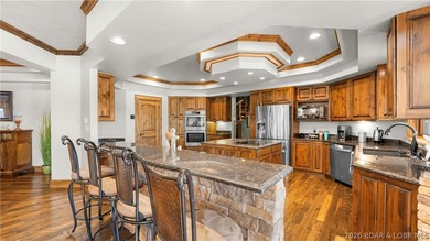 Lodge-style lakefront retreat sitting on over 1 acre with an - photo 16