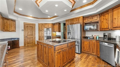 Lodge-style lakefront retreat sitting on over 1 acre with an - photo 17
