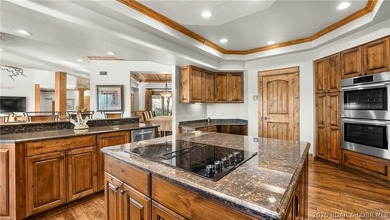 Lodge-style lakefront retreat sitting on over 1 acre with an - photo 19