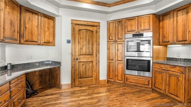 Lodge-style lakefront retreat sitting on over 1 acre with an - photo 21
