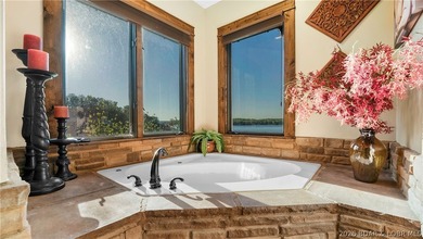Lodge-style lakefront retreat sitting on over 1 acre with an - photo 29