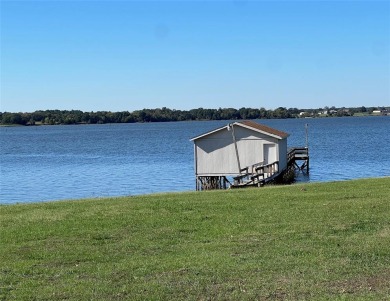 This waterfront property boasts a panoramic view of Lake Fork - Lake Home For Sale in Emory, Texas