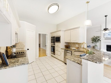 Grand marble tile entry and soaring ceilings set the tone in - photo 31