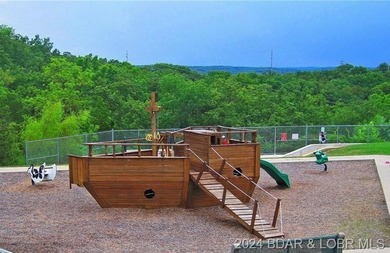 Four Seasons Building Lot that is fairly level and wooded - photo 5