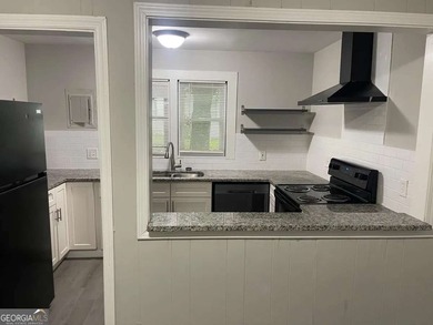 This charming 3- bedroom, 2-bathroom home offers 1,100 sq ft of - photo 3