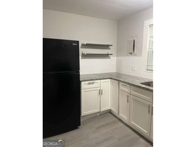 This charming 3- bedroom, 2-bathroom home offers 1,100 sq ft of - photo 5