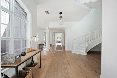 Welcome to Golf Brook Drive, an exclusive address within the - photo 3