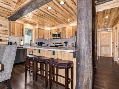Custom-built Northwoods log sided home offering a rare, fully - photo 15