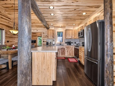 Custom-built Northwoods log sided home offering a rare, fully - photo 16