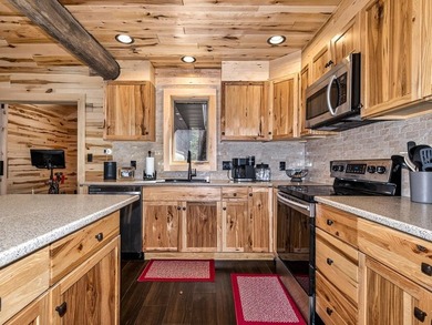 Custom-built Northwoods log sided home offering a rare, fully - photo 17
