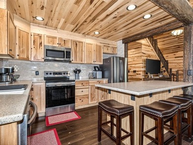Custom-built Northwoods log sided home offering a rare, fully - photo 18
