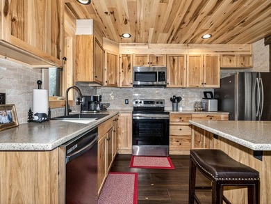 Custom-built Northwoods log sided home offering a rare, fully - photo 19