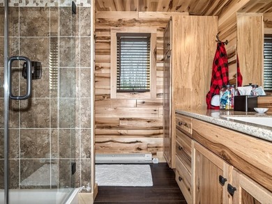 Custom-built Northwoods log sided home offering a rare, fully - photo 25