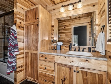 Custom-built Northwoods log sided home offering a rare, fully - photo 31