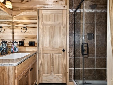 Custom-built Northwoods log sided home offering a rare, fully - photo 39